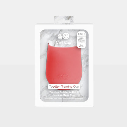 ezpz mini cup in coral, silicone drinking cup for toddler with packaging