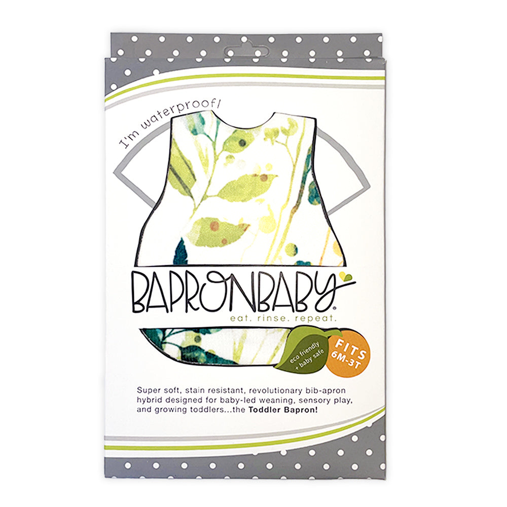 The bapron apron in packaging, in "autumn leaves" pattern