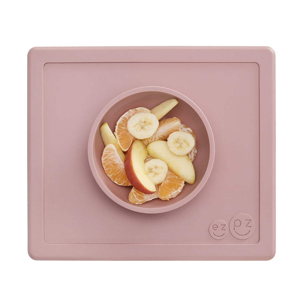 ezpz happy bowl in blush, bowl/placemat in one for babys first foods