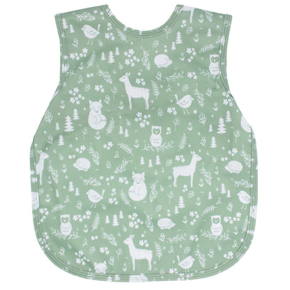 A bapron apron/bib in a mint green pattern called "Forest Friends"