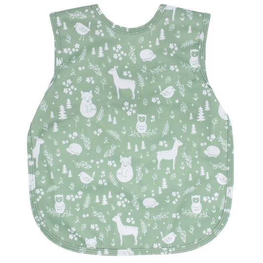 A bapron apron/bib in a mint green pattern called "Forest Friends"