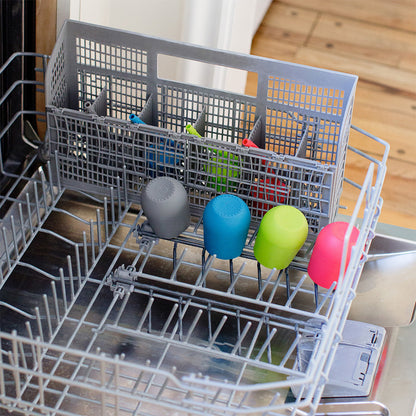 a dishwasher with the ezpz cup and straw training system in multiple colours
