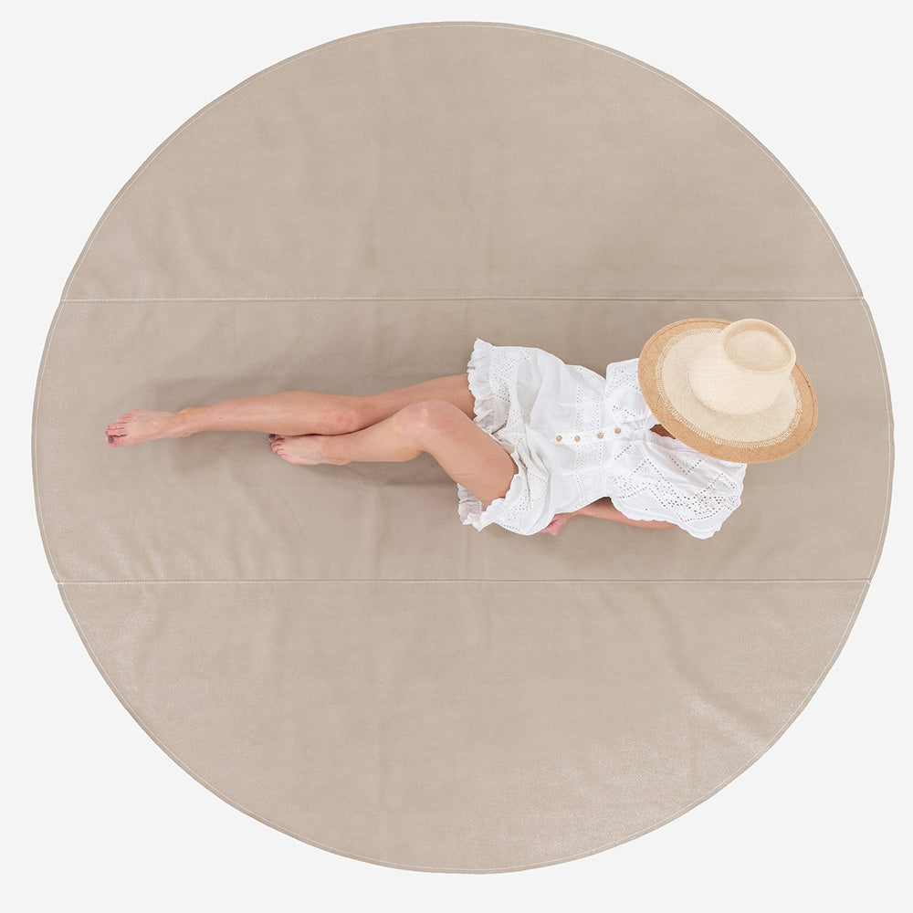 woman laying on the gathre maxi circle mat in fog