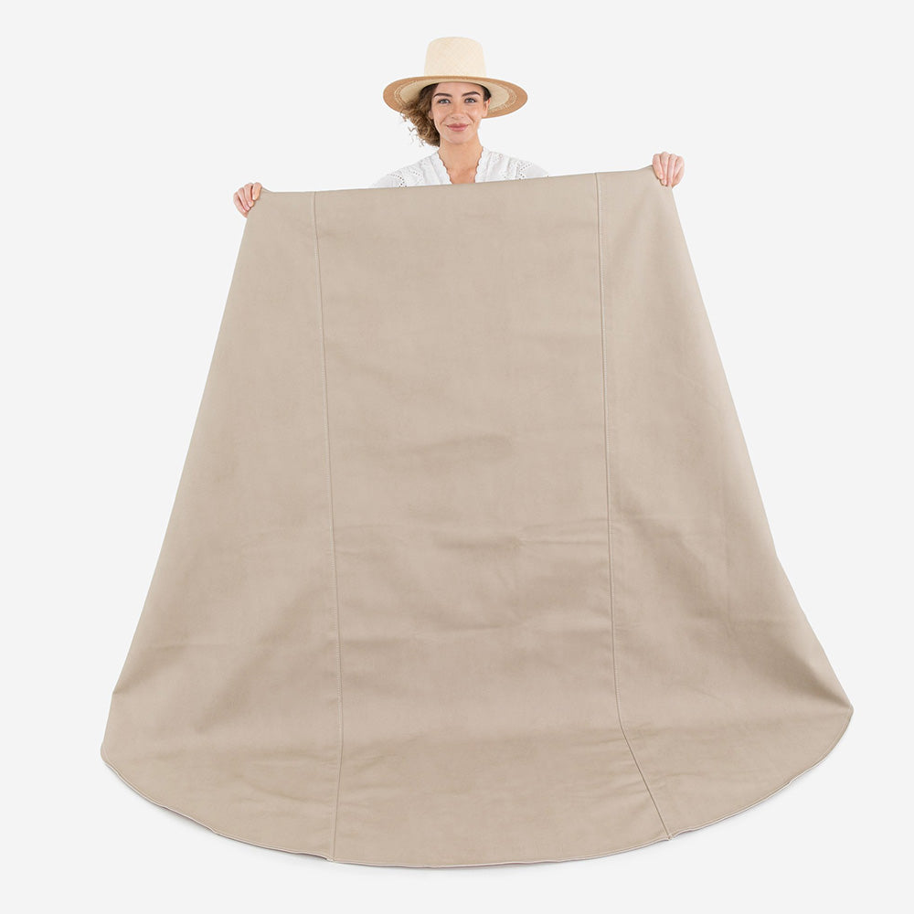 woman holding up the gathre maxi circle mat in fog